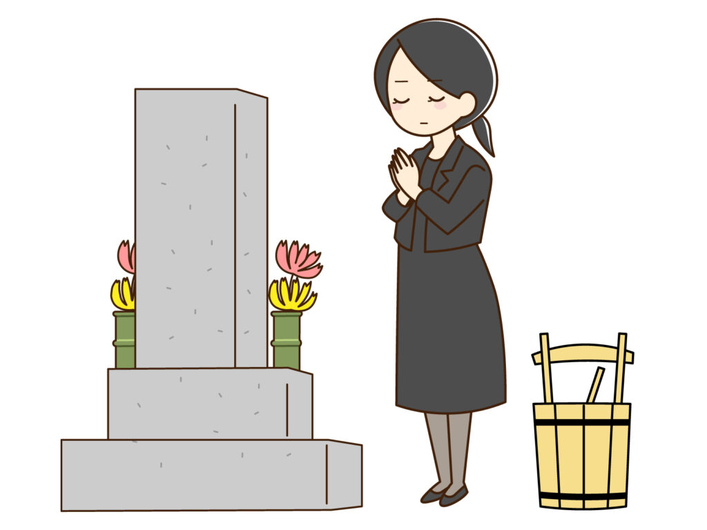 喪服でお参りする女性